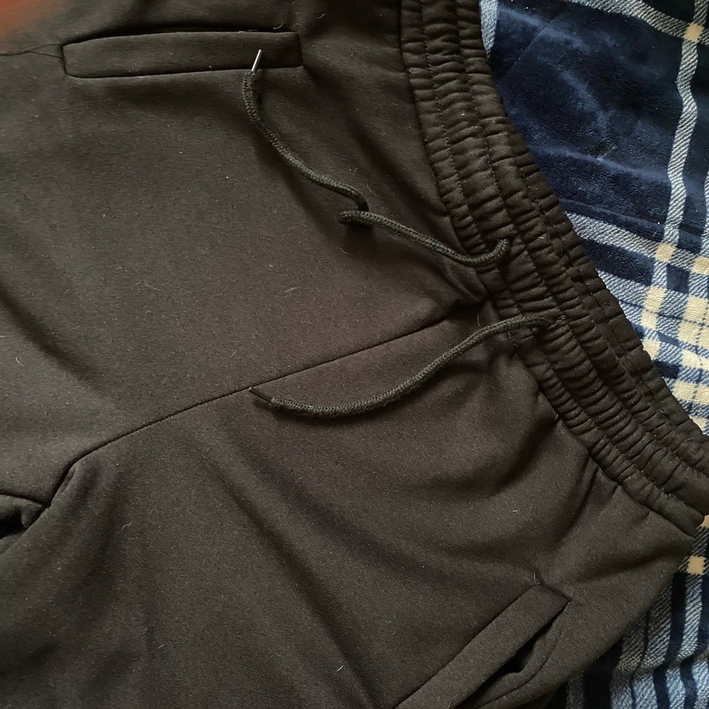 STACKED black sweatpants